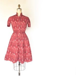 60s red fit and flare peacock dress